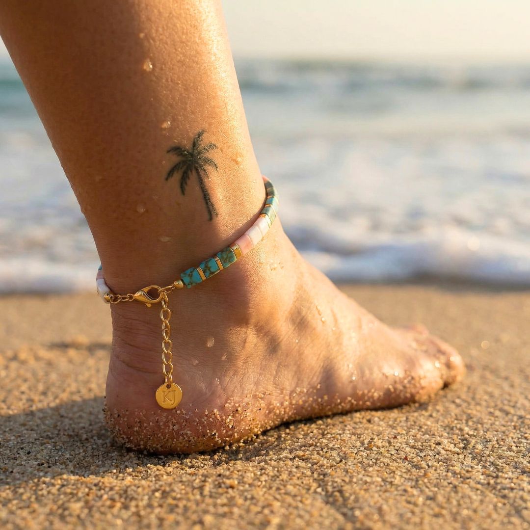 Ankle with anklets on a beach