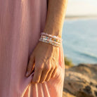 Person wearing a bracelet with a scenic background