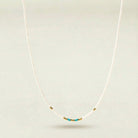 Necklace with turquoise beads on a white background